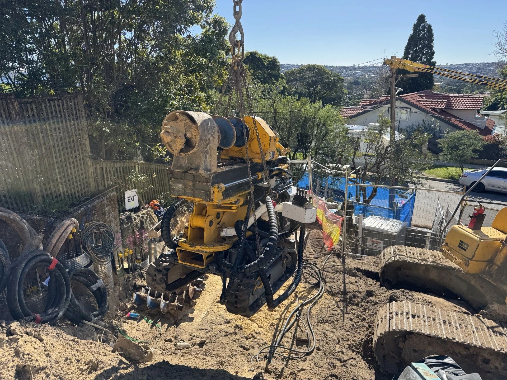 Compact drilling equipment being positioned on a constrained residential construction site